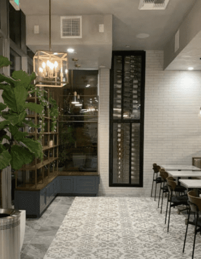 A rendering of a restaurant with tables and chairs.