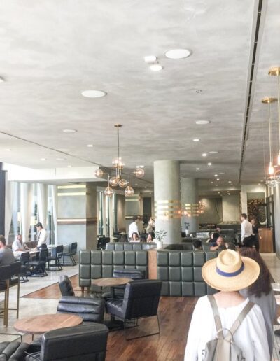 The interior of a restaurant with tables and chairs.