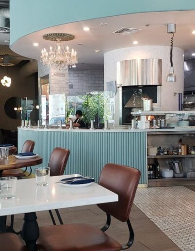 The interior of a restaurant with tables and chairs.