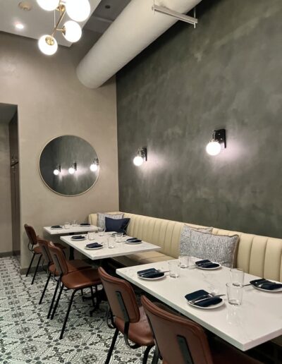 The dining room of a restaurant with a tiled floor.