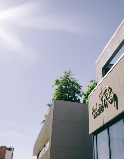 A building with a sun shining on it.